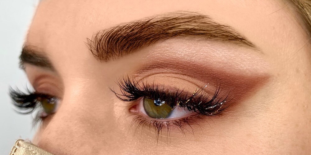 girl with make up and extended lashes